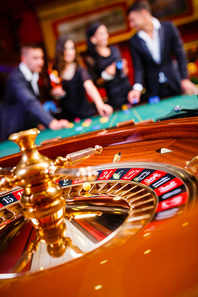 Live dealer at Bikini Paradise roulette table on mobile phone screen